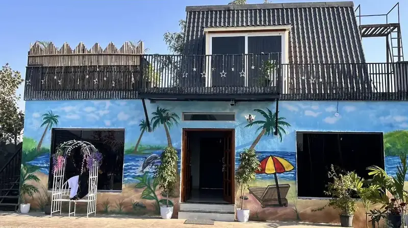 Common hall with a painted beach mural