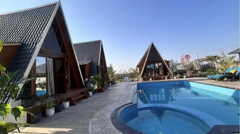 Cottages lining the pool deck