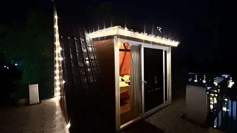 The Terrace Cottage lit at night